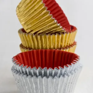 Stack of decorative metallic foil cake and muffin cases credit: Marie-Louise Avery Stack of decorative metallic foil cake and muffin cases credit: Marie-Louise Avery