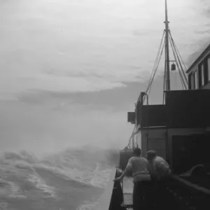 Steamship navigating through rough seas. 1936