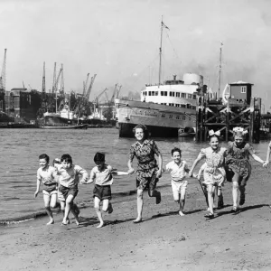 Summer at last, children running on the beach by the Tower of London Print Summer at last, children running on the beach by the Tower of London Print