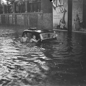 Kingston Flood Print: Swimmers near Submerged Vehicles Kingston Flood Print: Swimmers near Submerged Vehicles
