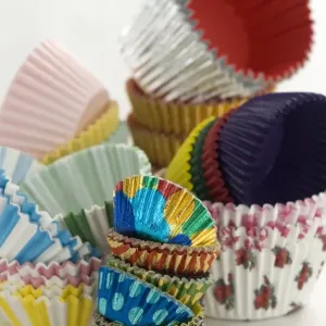 Variety of colourful muffin cases stacked high credit: Marie-Louise Avery / thePictureKitchen Variety of colourful muffin cases stacked high credit: Marie-Louise Avery / thePictureKitchen