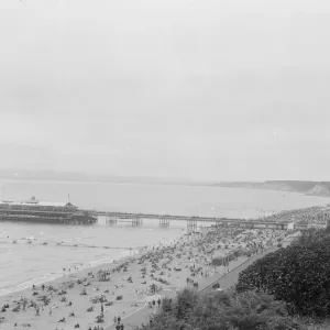 A view over Bournemouth showing the beach and pier. 1925