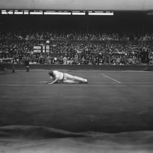 Vincent Richards defeated by Cochet at Wimbledon. Richards falls in returning a Vincent Richards defeated by Cochet at Wimbledon. Richards falls in returning a