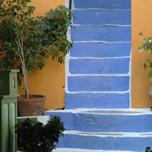 Vivid contrasting colours on stairway and walls in openair restaurant on waterfront
