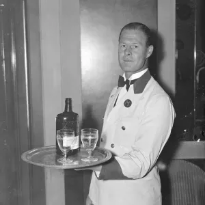 Waiter who strikes a different note, successful composer of music in his spare time Waiter who strikes a different note, successful composer of music in his spare time