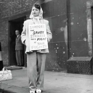Black and white print of a woman picketing outside the Savoy hotel Black and white print of a woman picketing outside the Savoy hotel