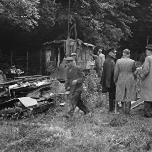 Watchers watch on as a shack in Kingsdown is demolished. 1936