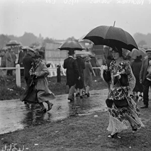 Wet Ascot. A visitor who went prepared for the rain. 18 June 1930