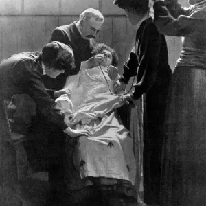 A Woman Suffragette Prisoner Being Force Fed with a Tube, 1912 Print A Woman Suffragette Prisoner Being Force Fed with a Tube, 1912 Print