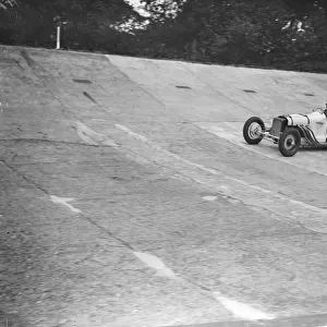 Women racing drivers practice for the bank holiday meet at Brooklands. Miss Allan