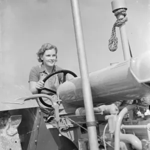 Womens Land Army in training on the fields of Wye, Kent. Here a Land Girl is