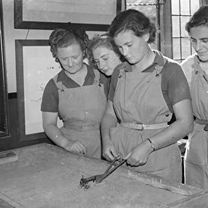 Womens Land Army in training in Wye, Kent. Here the Land Girls are being given