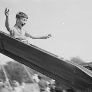 A young boy on a slide in Dartford, Kent. 1939