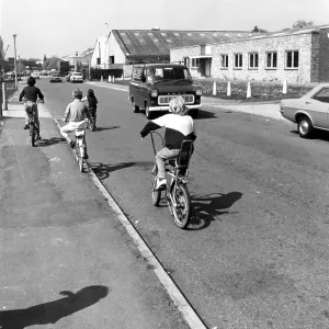 Young boys riding their bicycles around the Trading Estate, Fircroft Way, Edenbridge, Kent, England, UK. Circa 1970's Young boys riding their bicycles around the Trading Estate, Fircroft Way, Edenbridge, Kent, England, UK. Circa 1970's