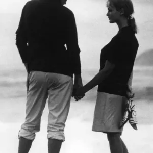 Young Couple Holding Hands Beach Print Young Couple Holding Hands Beach Print