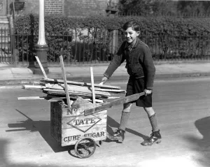 11 year old Lambeth boy sells firewood from bombed houses for Londons War weapon
