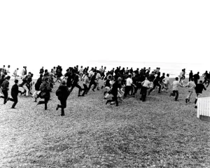 Police Prints: 1964. Hastings. Mods and Rockers clash. 3rd August. Racing along the beach