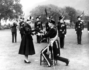26th June 1952: Queen Elizabeth II being presented with a brooch by the Duke of Buccleuch