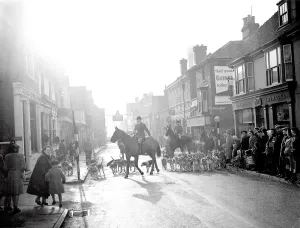 Hunting Prints: 3 December 1952 Leading the fox hunt through Edenbridge High Street. Edenbridge