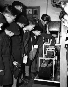 Mechanical Prints: 31 / 18 / 1951 Tom Rowland, a miner from Snowdown Pit, Kent, explains the working of