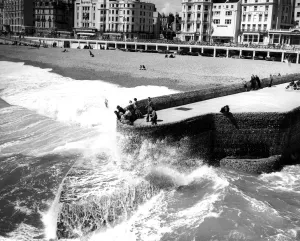 Beach Prints: 31 May 1958 Visitors to Brighton watch as seas break against the Groyne - ever