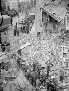 Wounded Prints: 9 November 1940 A rescue party look for survivors in the bomb damage of a collapsed
