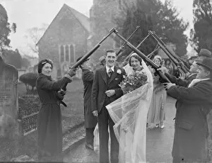 Procession Collection: The Acton and Clarke wedding at Crayford. The bride and groom walk through a guard