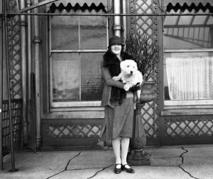 Actor Actress Prints: The actress, Miss Phyllis Titmuss pictured with her pet dog in Brighton, Sussex