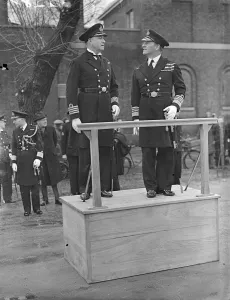 Admiral Evan inspects Navy training school commanded by man who rose from boy to Captains rank