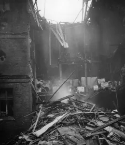 Britain Prints: Air raid results. A 50 kilo bomb fell on the pavement right immediately under