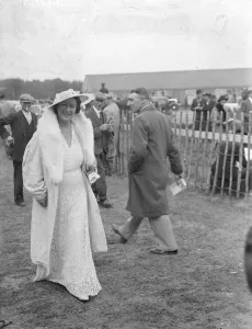 All white at the Derby. A woman Derby spectator in a striking white fashion at Epsom