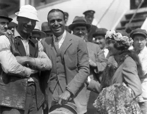 American actors Douglas Fairbanks and his wife Mary Pickford pictured with a stevedore