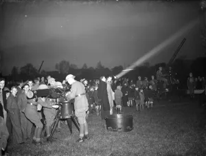 An anti aircraft display in Dartford, Kent. In the foreground personel operate