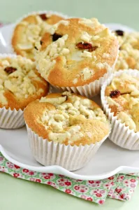 Apple struesel muffin in pile on white plate credit: Marie-Louise Avery / thePictureKitchen