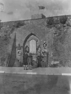 Wreath Prints: Armistice memorial service in Crayford, Kent. Two boys pay their respect
