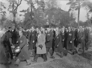 Armistice memorial service in Sidcup, Kent. Veterans march through the street