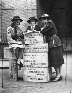 Girls Prints: Three Australian Girl Guides check over some of the ingredients at the Girl Guide