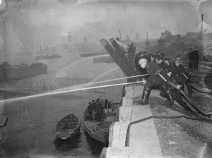 Preparation Prints: The Auxiliary Fire Service during a hose practice drill by the River Thames at Greenwich