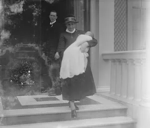The baby Prince leaving 3 Belgrave Square in the arms of his nurse for Buckingham Palace