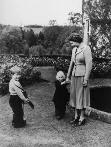 Family Prints: Balmoral: Prince Charles smiles happily as he waits to take a picture of the Queen