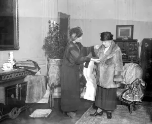 Fur Coat Prints: The Baroness De Brienen in her drawing room - saleroom at 1. Mount Row. W. 1. Where