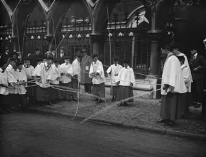 Beating the bounds of St Clement Danes. Choirboys beating the bounds outside St