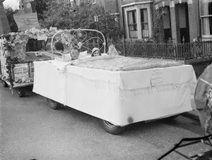 Celebrate Prints: A bed car in the Dartford Carnival procession. 1939