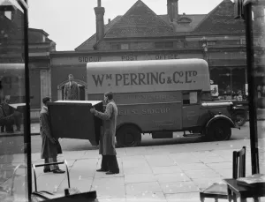 A Bedford truck belonging to W Perring and Co Ltd, the house furnishers. Workers
