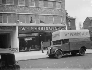 A Bedford truck belonging to W Perring and Co Ltd, the house furnishers. Workers