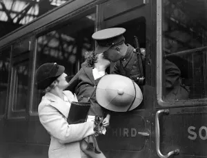 Bidding his daughter and wife goodbye a Royal Engineer ( Postal Section ) off to