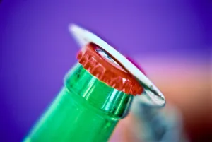 Glass Prints: Bottle opener removing cap from bottle of beer credit: Marie-Louise Avery / thePictureKitchen
