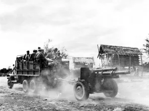 Bound for the Laos front Laotian government troops and their artillery weapon speed