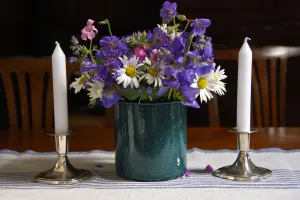 Decorative Prints: Bouquet of country garden flowers in enamel pot on table with silver candlesticks