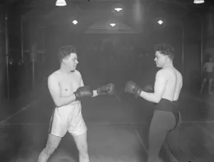 Boxers in duplicate. Jack ( in black trunks ) and Dick Gutteridge, the twin sons